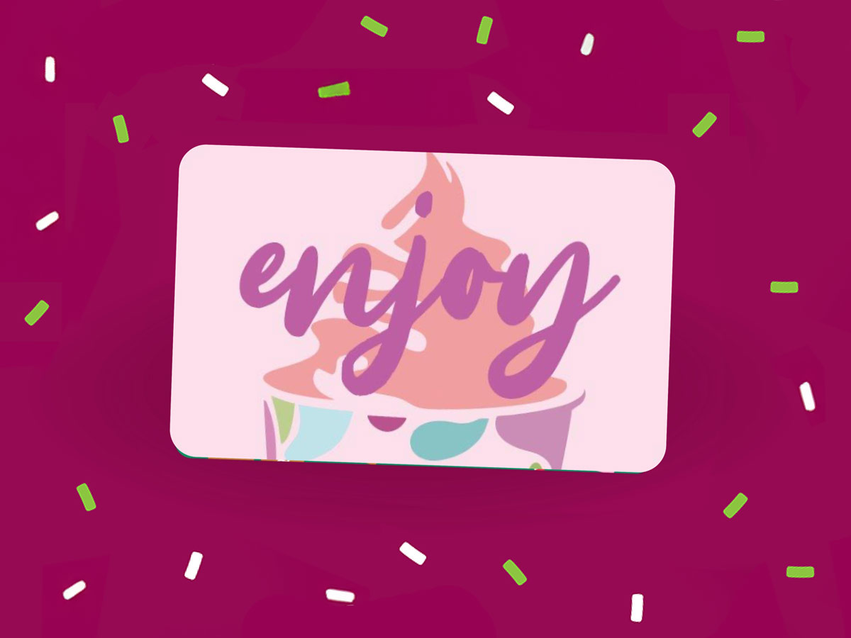 A group of Yogurtland cups of frozen yogurt and toppings